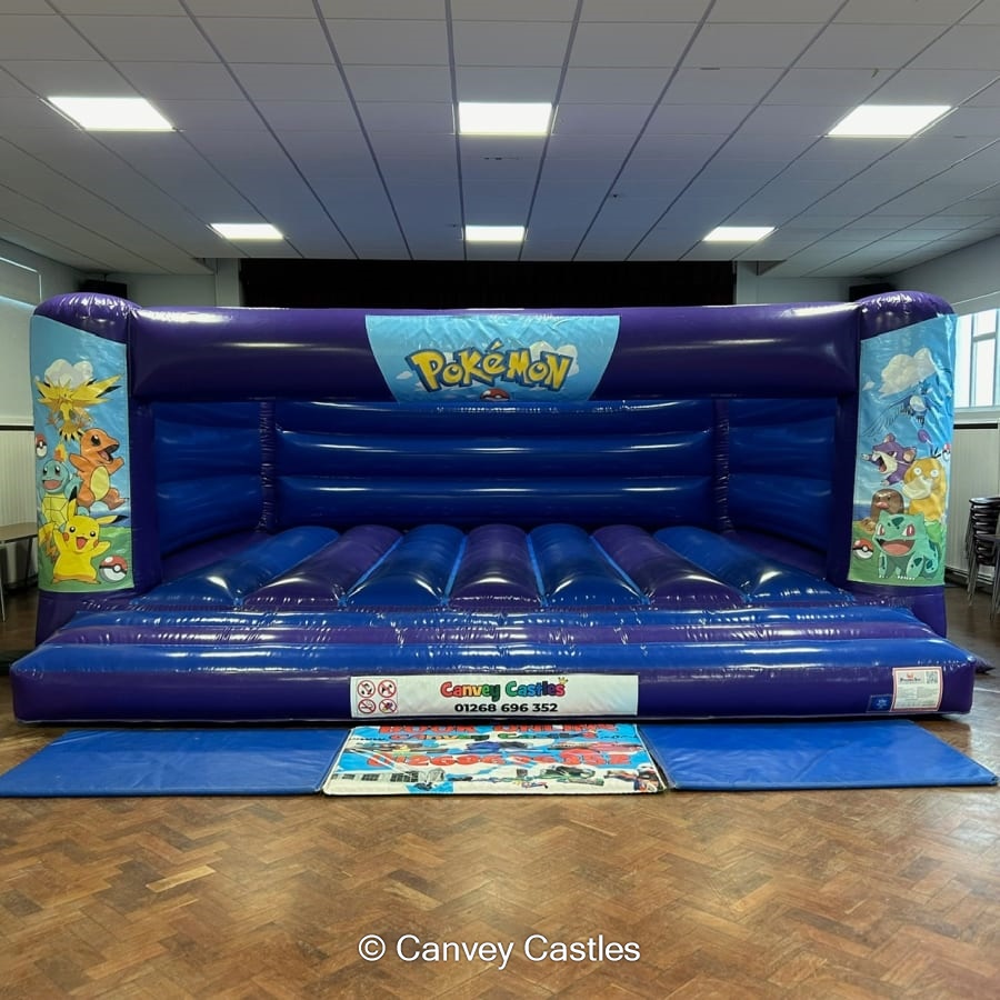 19ft x 18ft Blue and Purple Pokemon Bouncy Castle (low height) Bouncy Castle Hire in Essex